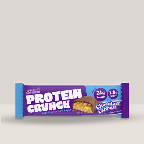Imagine cu o bară proteică Crunch Protein Bar 62g de la APPLIED NUTRITION, o gustare delicioasă și sănătoasă cu conținut ridicat de proteine cu aromă de caramel și ciocolată.