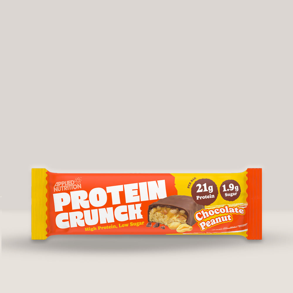 Imagine cu o bară proteică Crunch Protein Bar 62g de la APPLIED NUTRITION, o gustare delicioasă și sănătoasă cu conținut ridicat de proteine cu aromă de ciocolată și alune de pădure.
